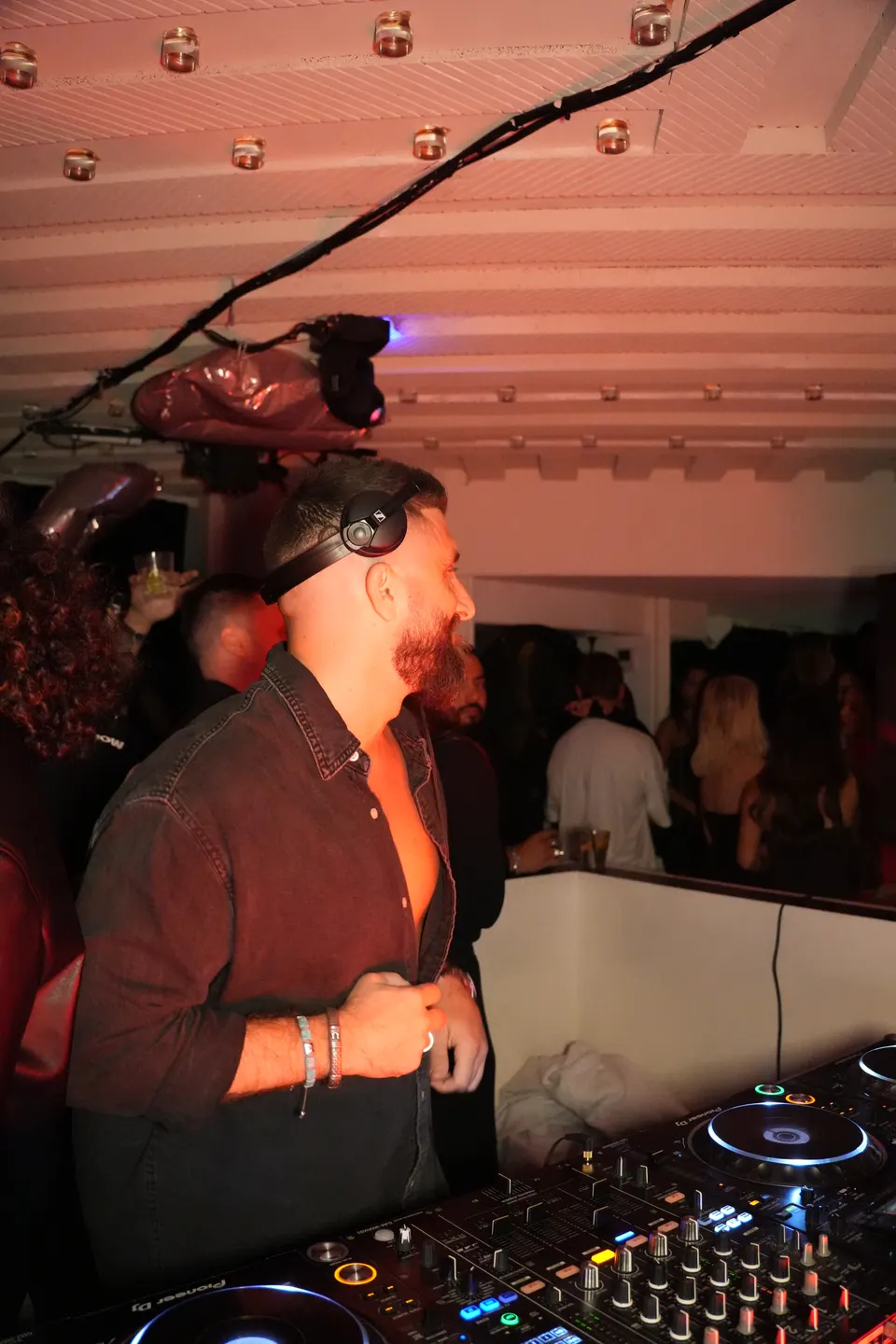 DJ at the decks in the Pelicano club