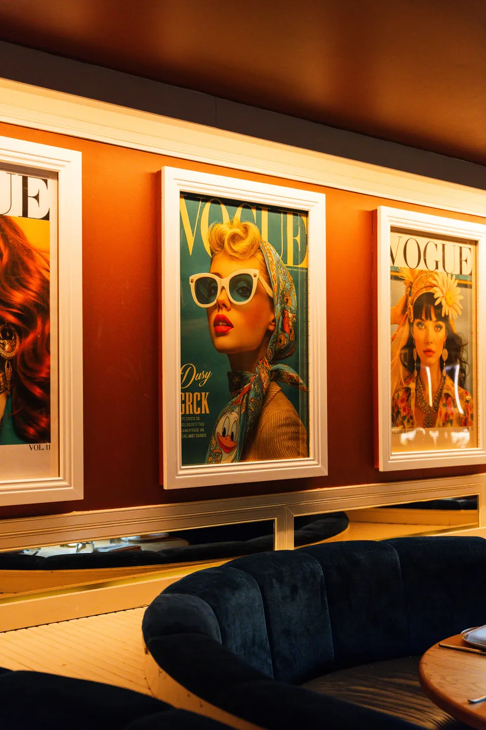 Lounge booth under Vogue prints at Pelicano, Potts Point