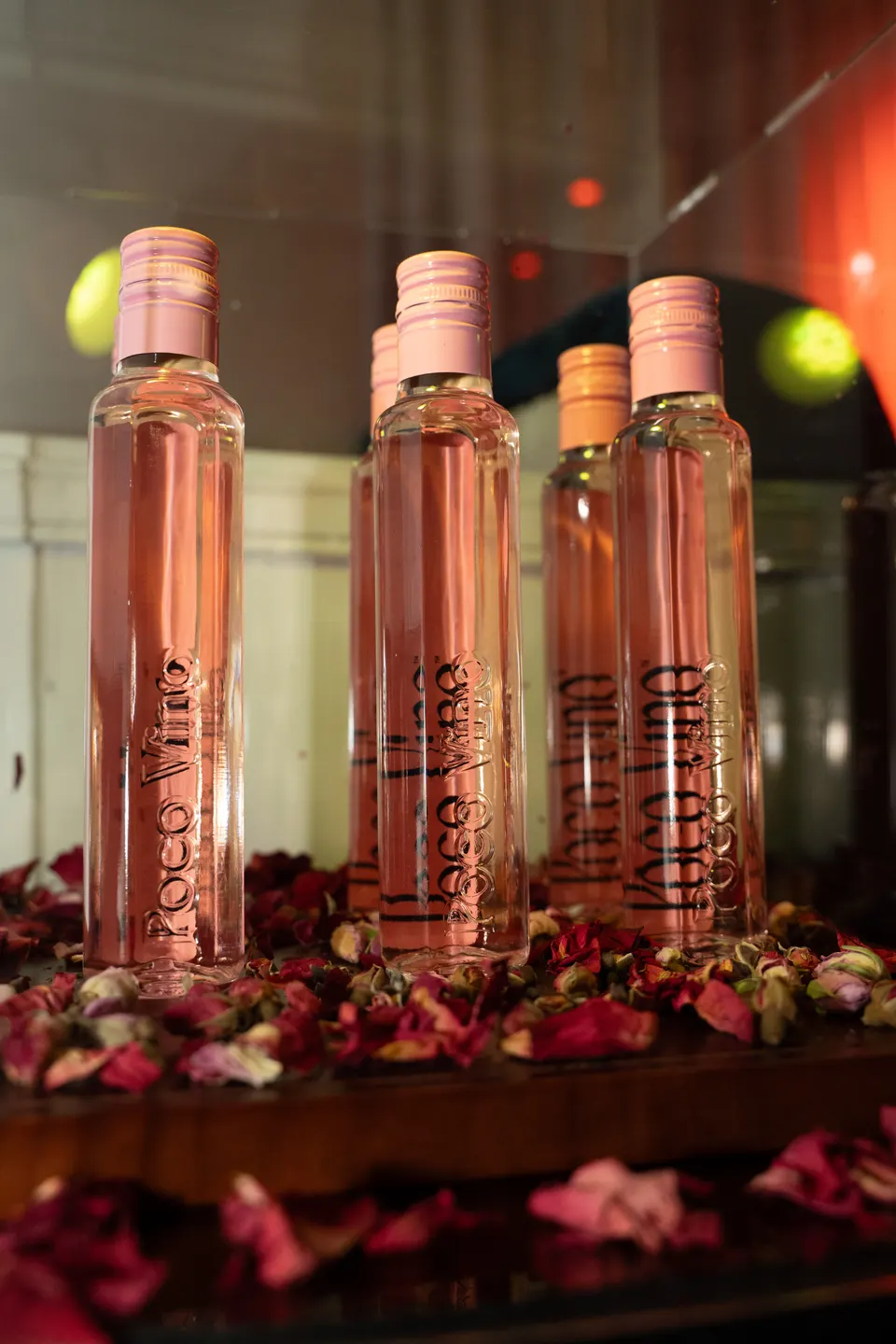 Rosé bottles lined up on the bar